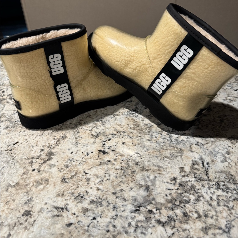 UGG Cream Shearling Boots with Black Accents